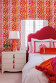 Bold pink bedroom featuring Fathom Hot Pink wallpaper, designed by McCann Design Group. A maximalist, feminist interior with expressive pattern and vibrant colour.